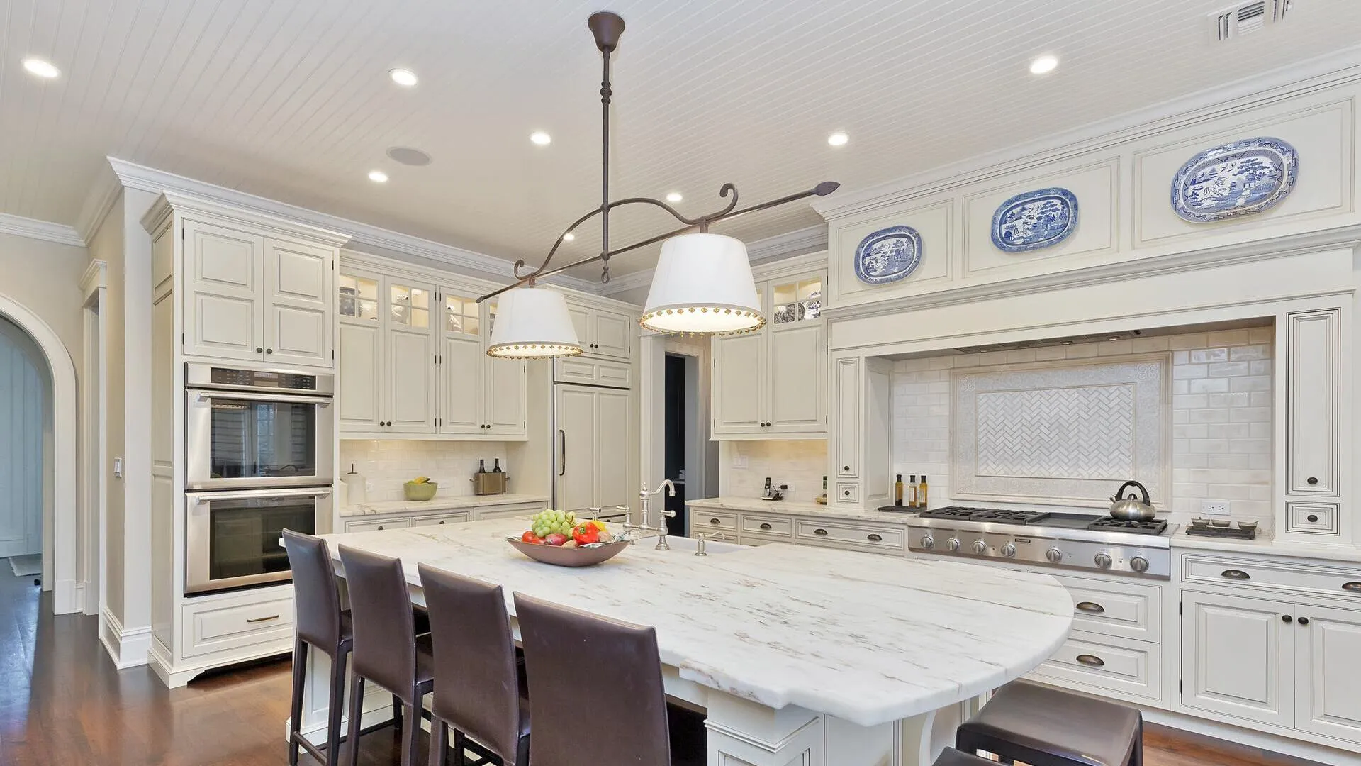 Grand kitchen with luxurious marble countertops.