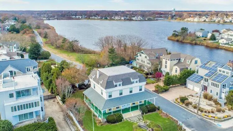Aerial view of homes by Wreck Pond in Sea Girt, showcasing the picturesque residential area.
