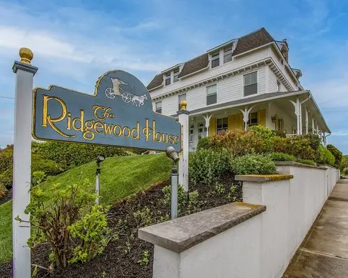 Outdoor photo of the Ridgewood House sign, marking the entrance to this historic property.